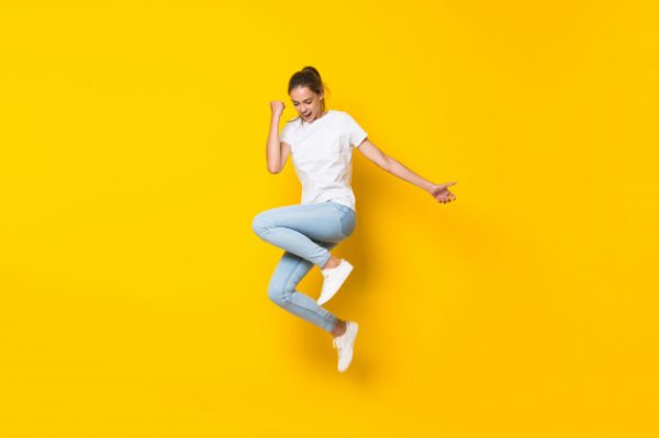young-woman-jumping-isolated-yellow-wall_1368-43192